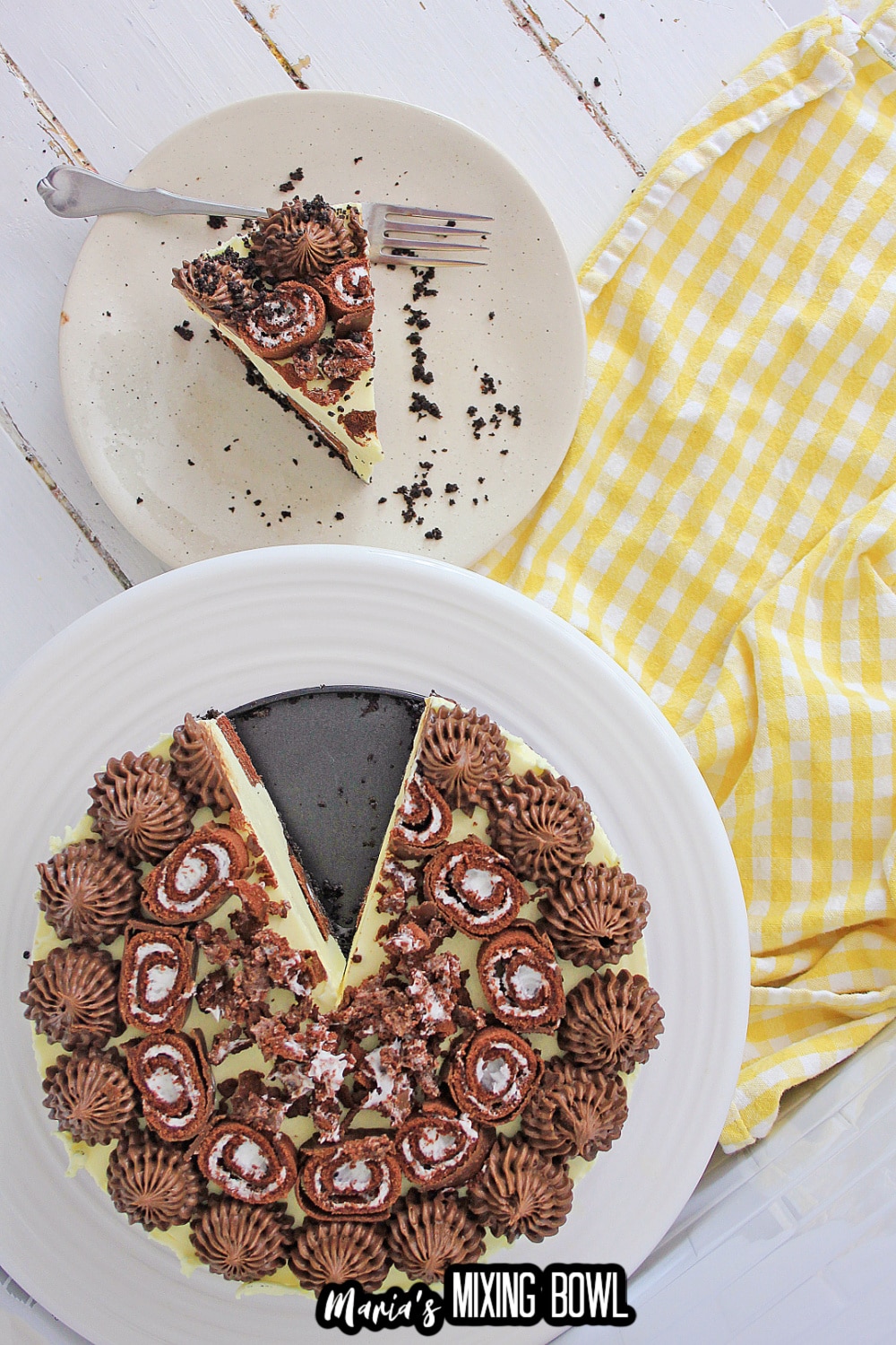 whole cheesecake with a slice cut from it, and on a plate