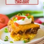 slice of tamale casserole on a stack of three plates