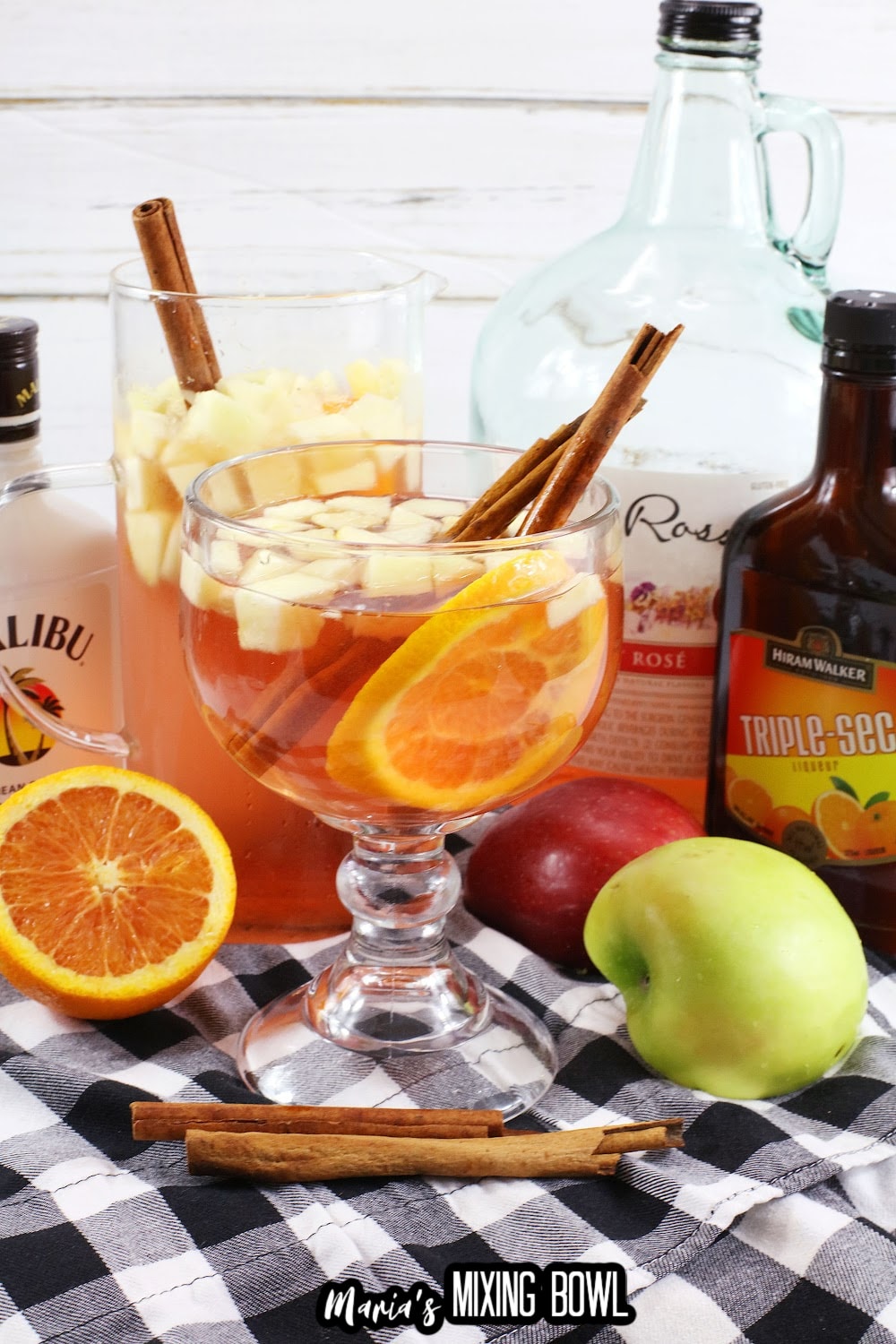 texas roadhouse sangria in a cocktail glass with cinnamon sticks