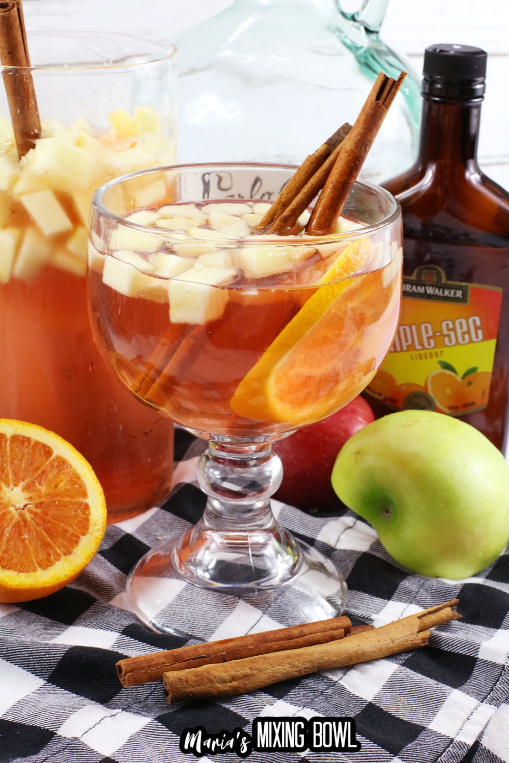 texas roadhouse sangria in a cocktail glass with cinnamon sticks