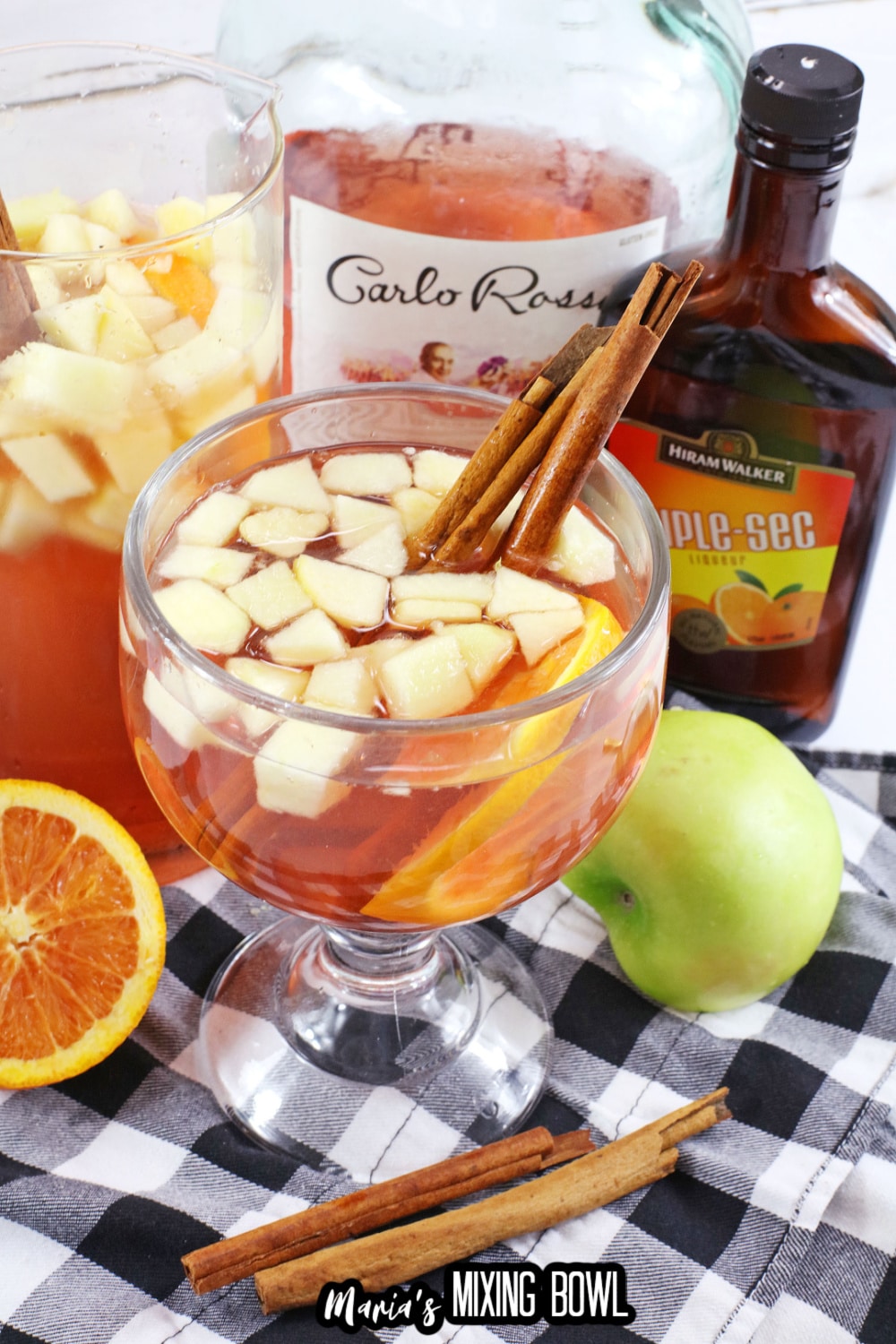 texas roadhouse sangria in a cocktail glass with cinnamon sticks