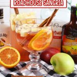 texas roadhouse sangria in a cocktail glass with cinnamon sticks