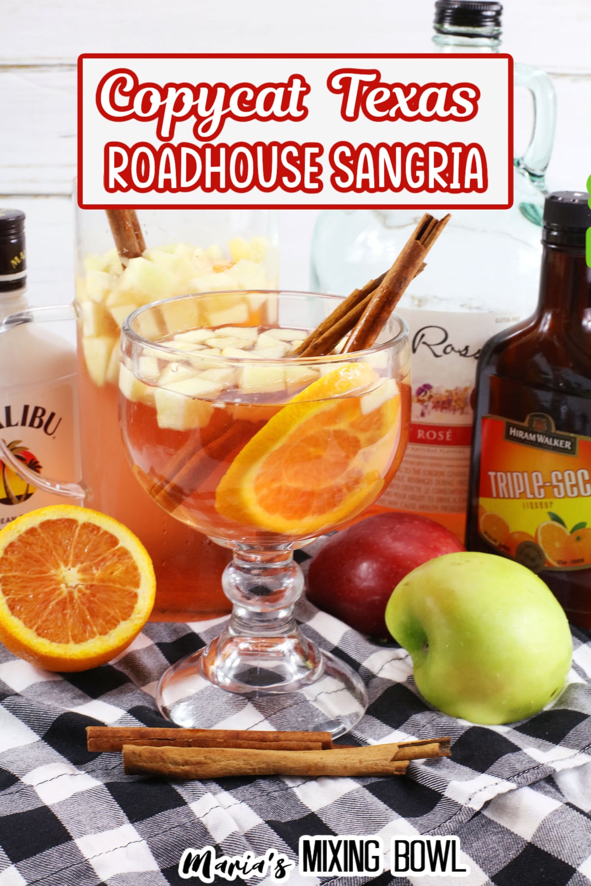 texas roadhouse sangria in a cocktail glass with cinnamon sticks