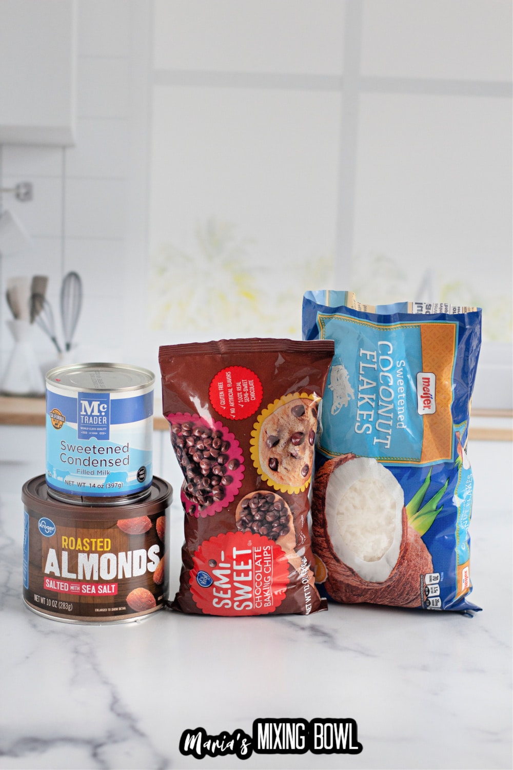 can of sweetened condensed milk, roasted almonds, chocolate chips, and shredded coconut