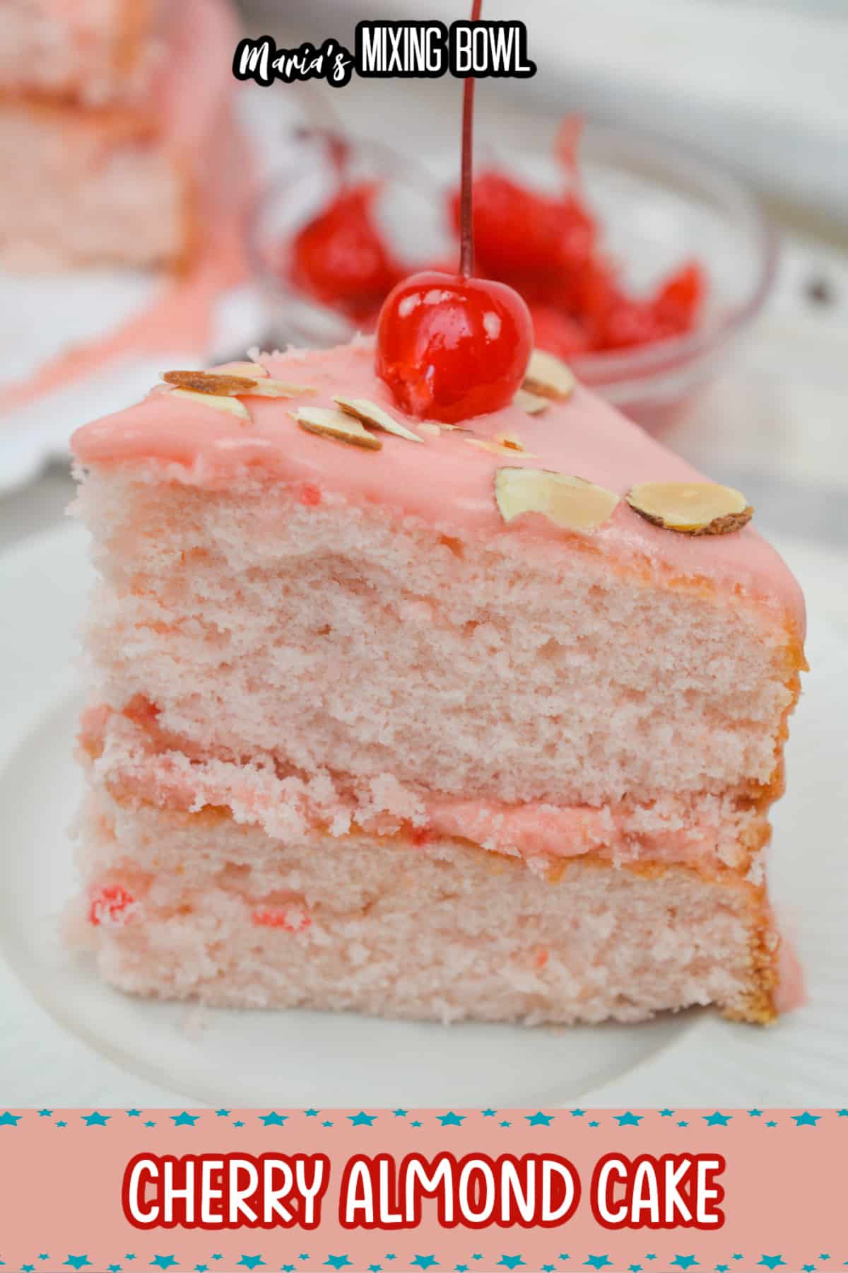 slice of cherry almond cake on a white plate