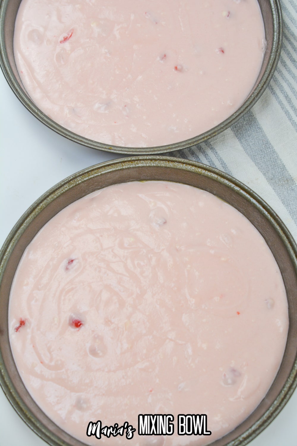 cake batter in two different round cake pans
