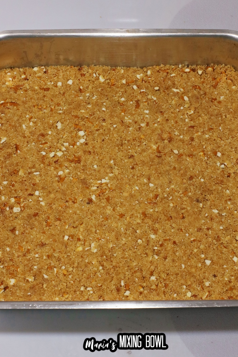 pretzel and graham cracker crust pressed into an 8x8 baking dish
