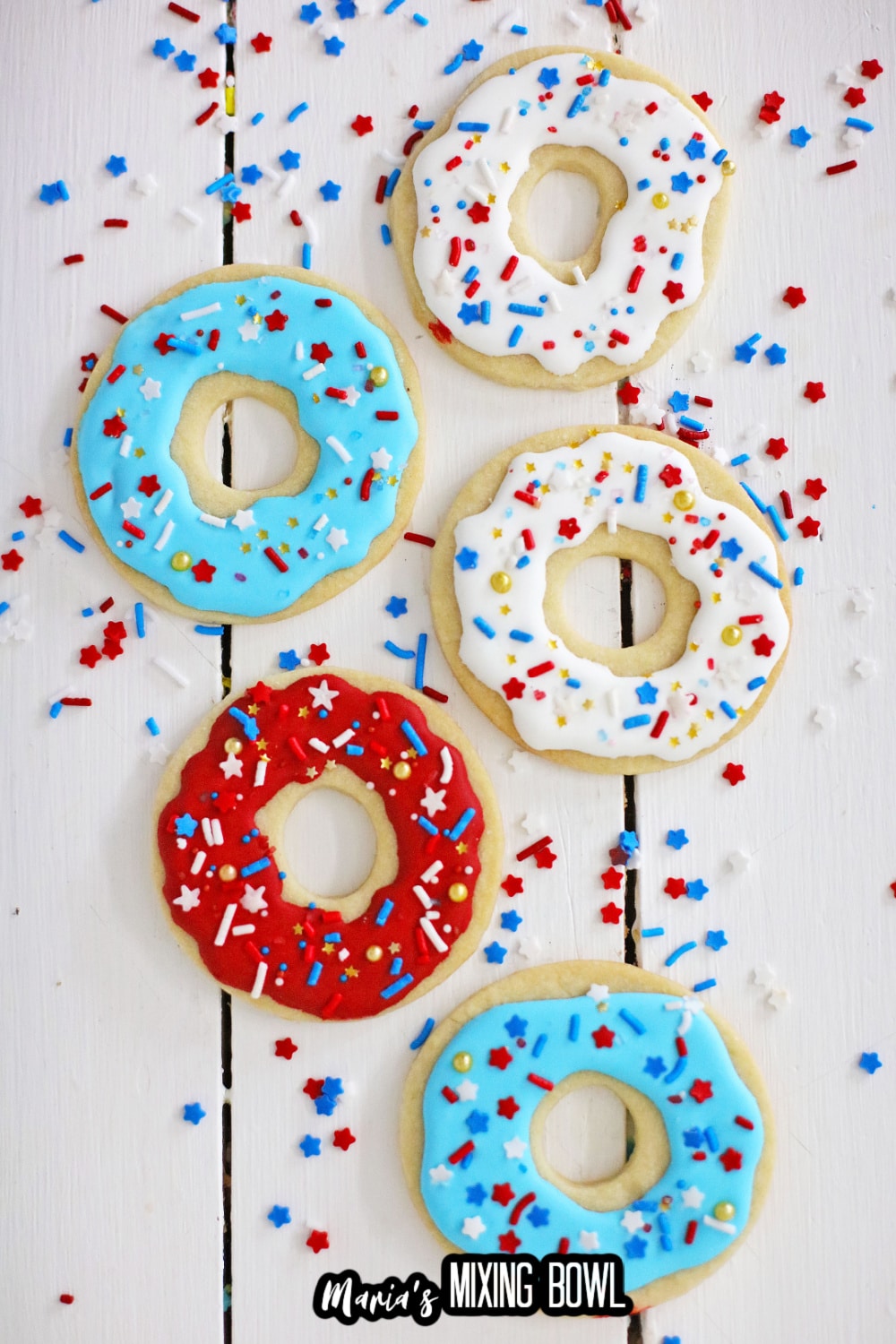 five donut cookies on a wooden cookies