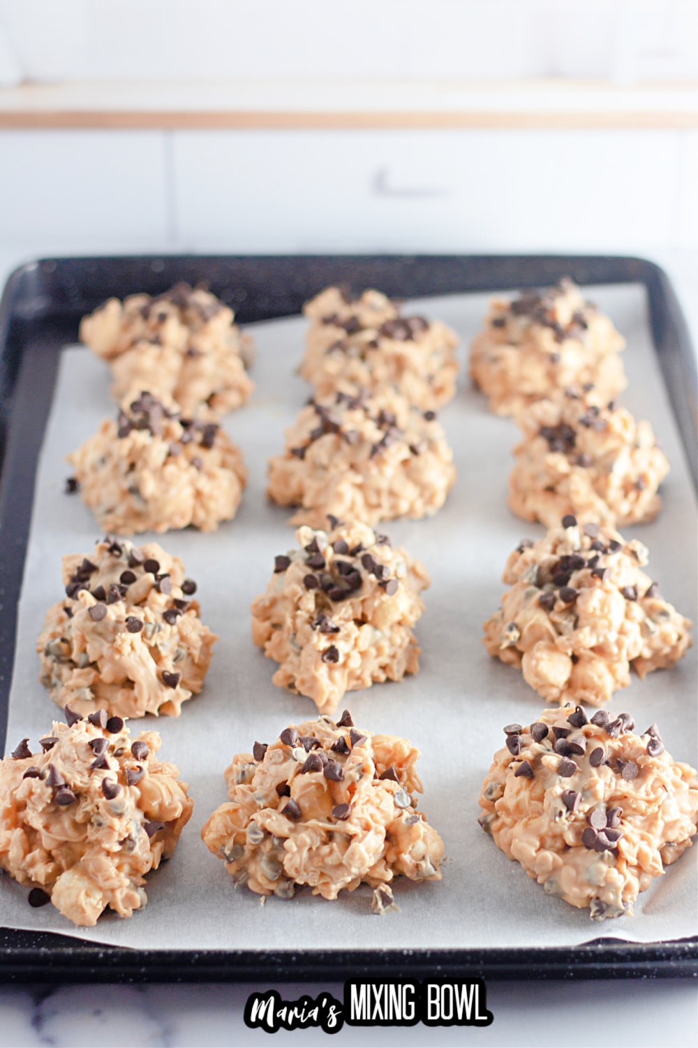 no bake cookies on a parchment lined baking sheet