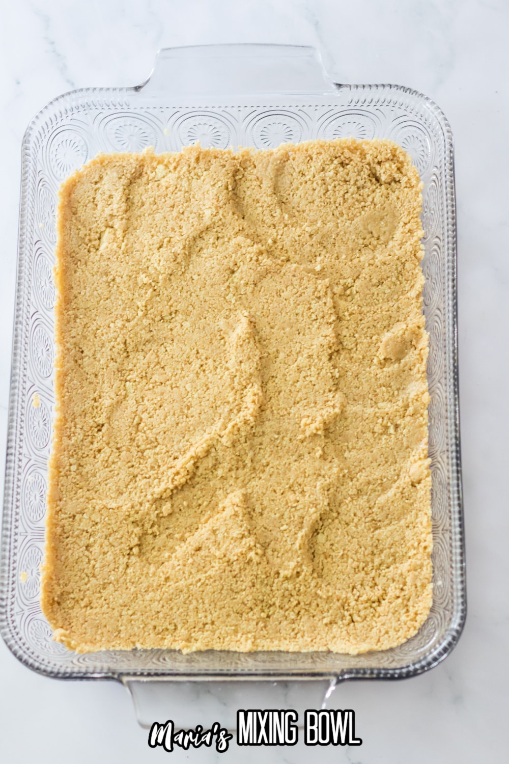 graham cracker crust pressed into a glass mixing bowl