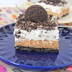 slice of oreo cheesecake delight on a blue plate