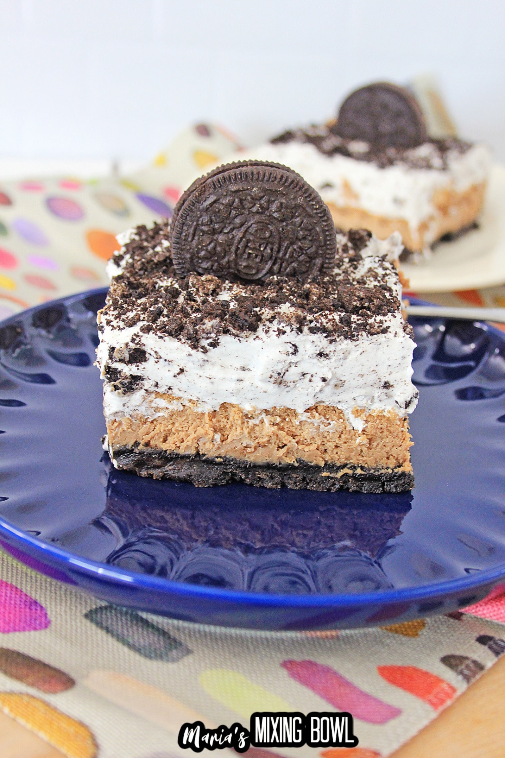 slice of oreo cheesecake delight on a blue plate