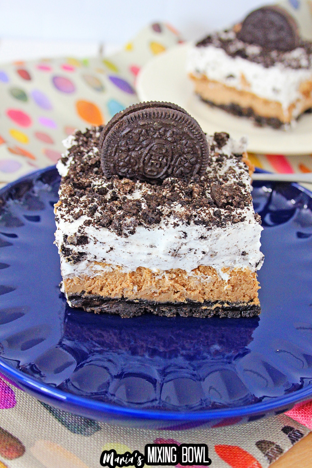 slice of oreo cheesecake delight on a blue plate