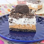 slice of oreo cheesecake delight on a blue plate