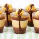 peanut butter cup shots on a green and white kitchen towel