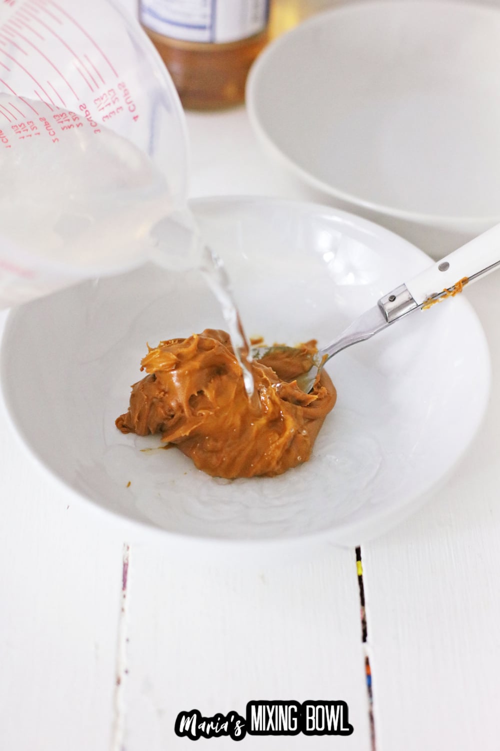 peanut butter and gelatin being mixed together