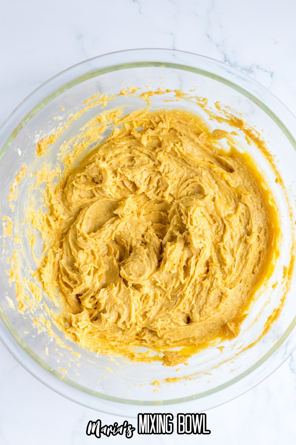peanut butter cookie dough in a glass mixing bowl