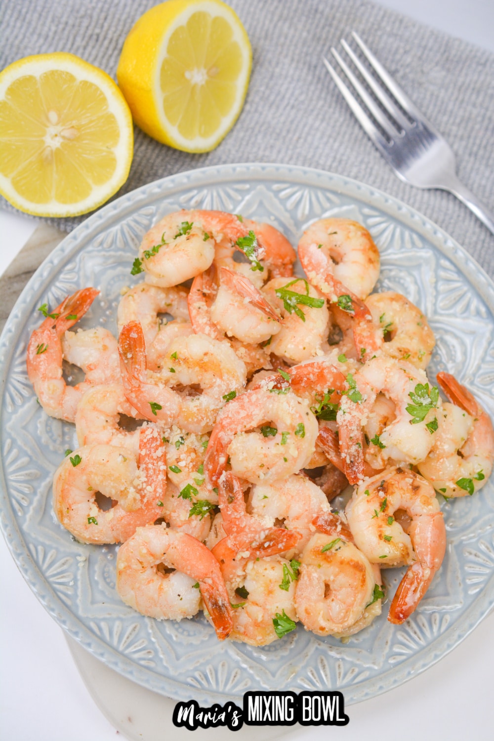 light blue and white plate full of shrimp scampi