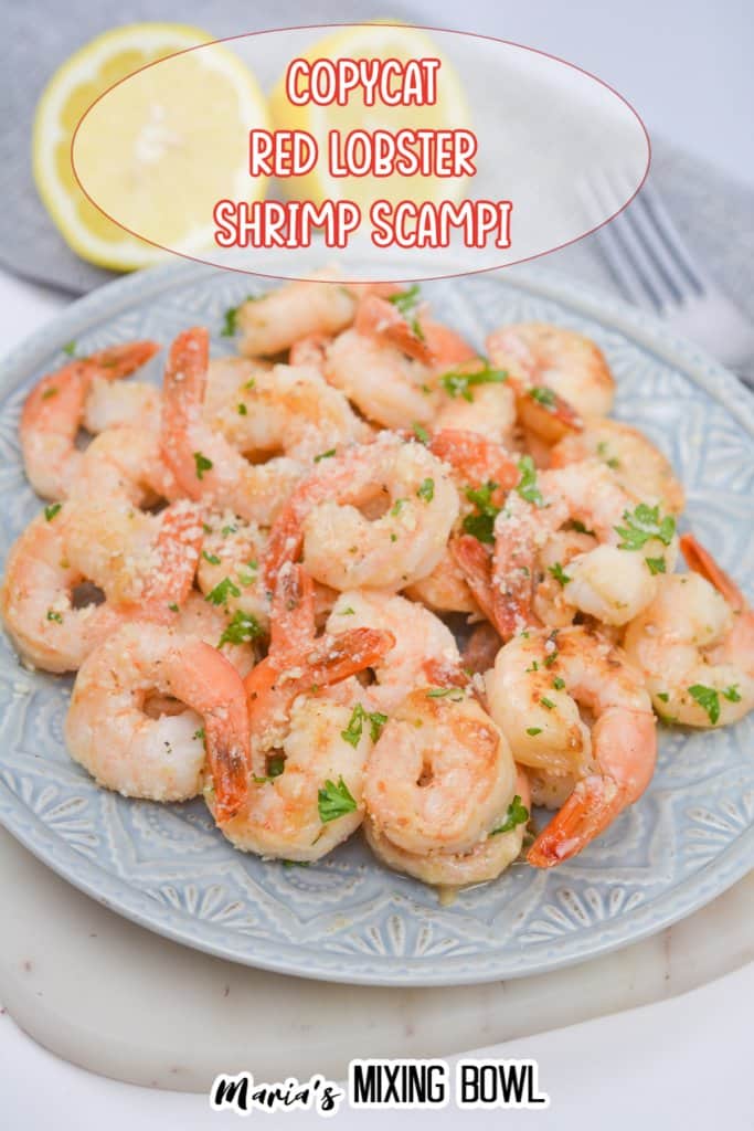 light blue and white plate full of shrimp scampi