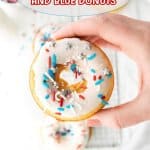 red white and blue donut held in a woman's hand