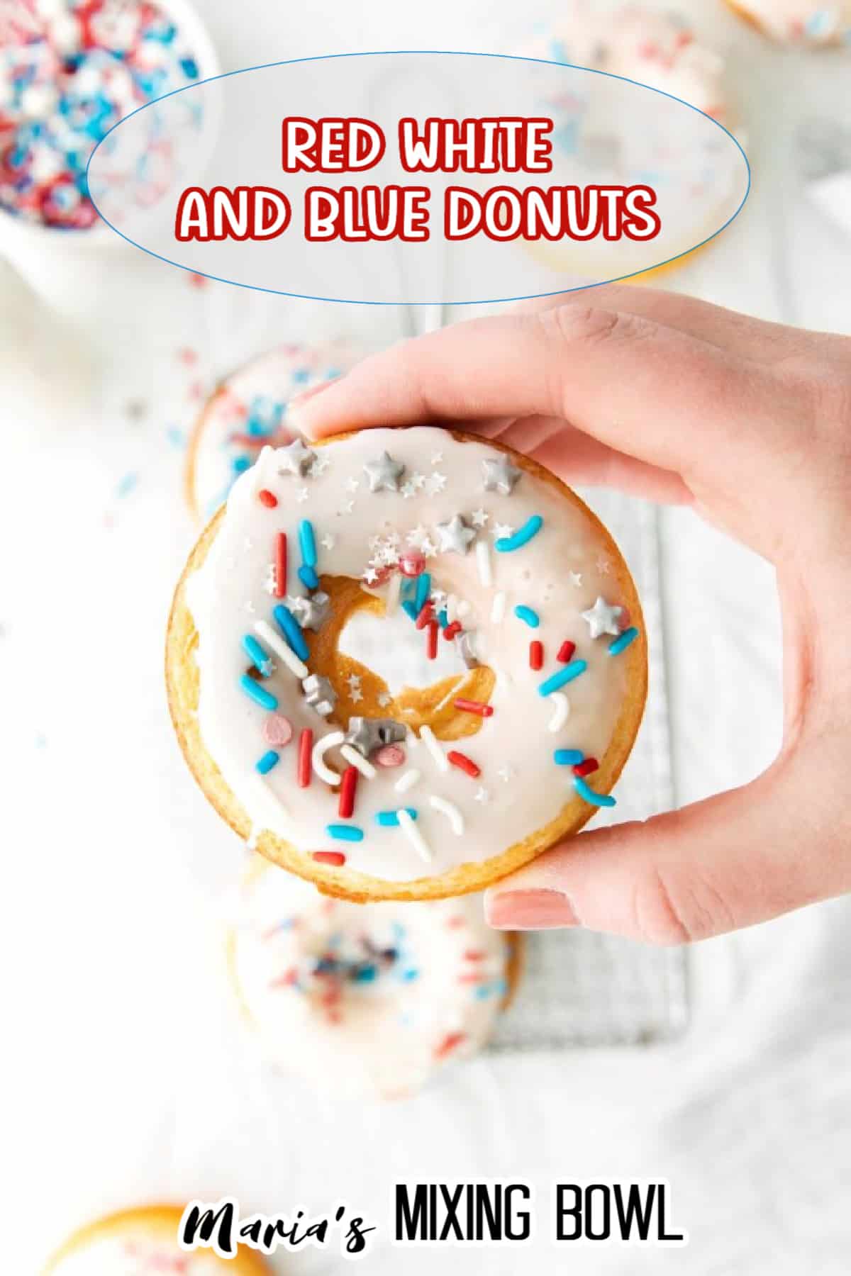 red white and blue donut held in a woman's hand