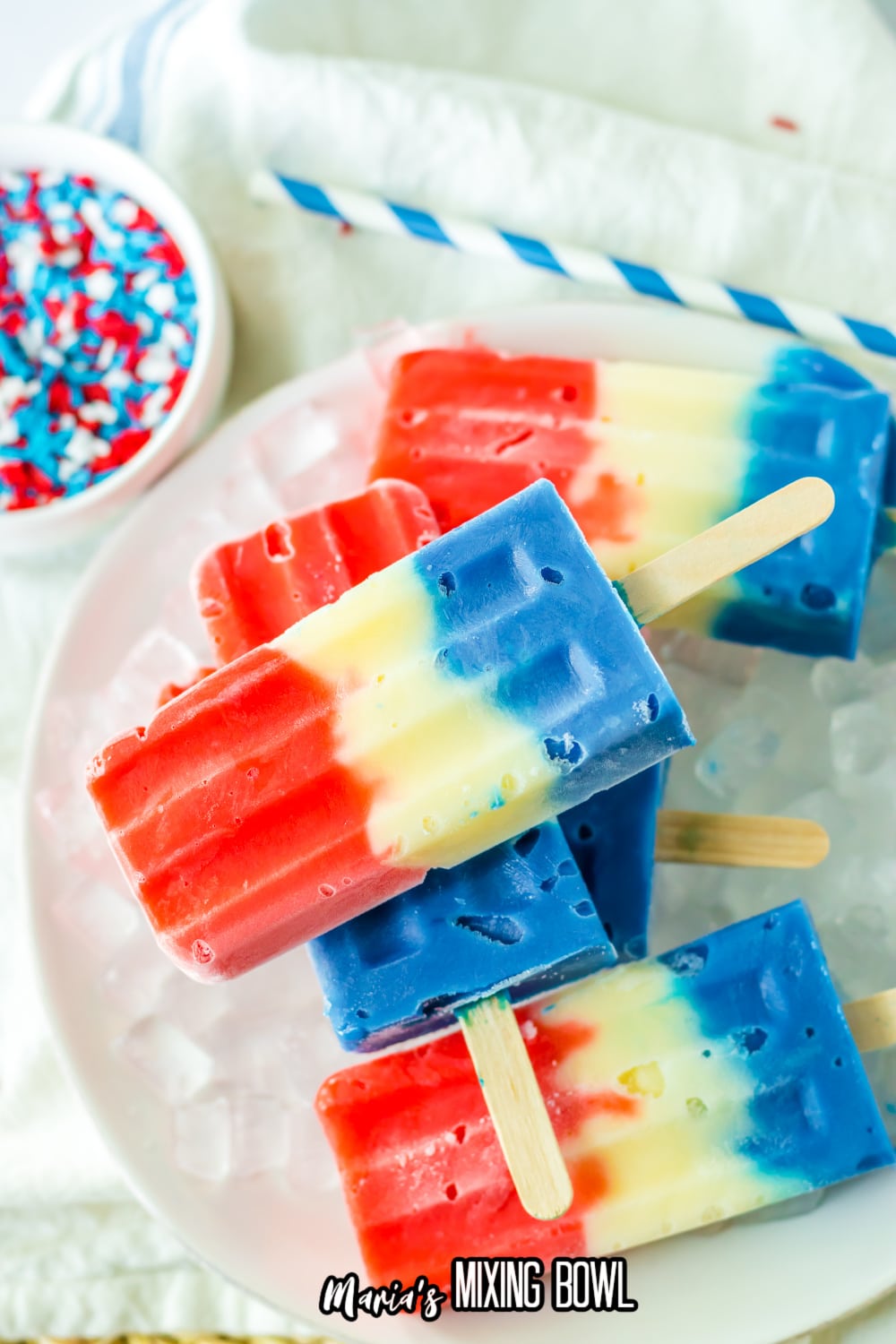 red white and blue pudding pops stacked on a bed of ice
