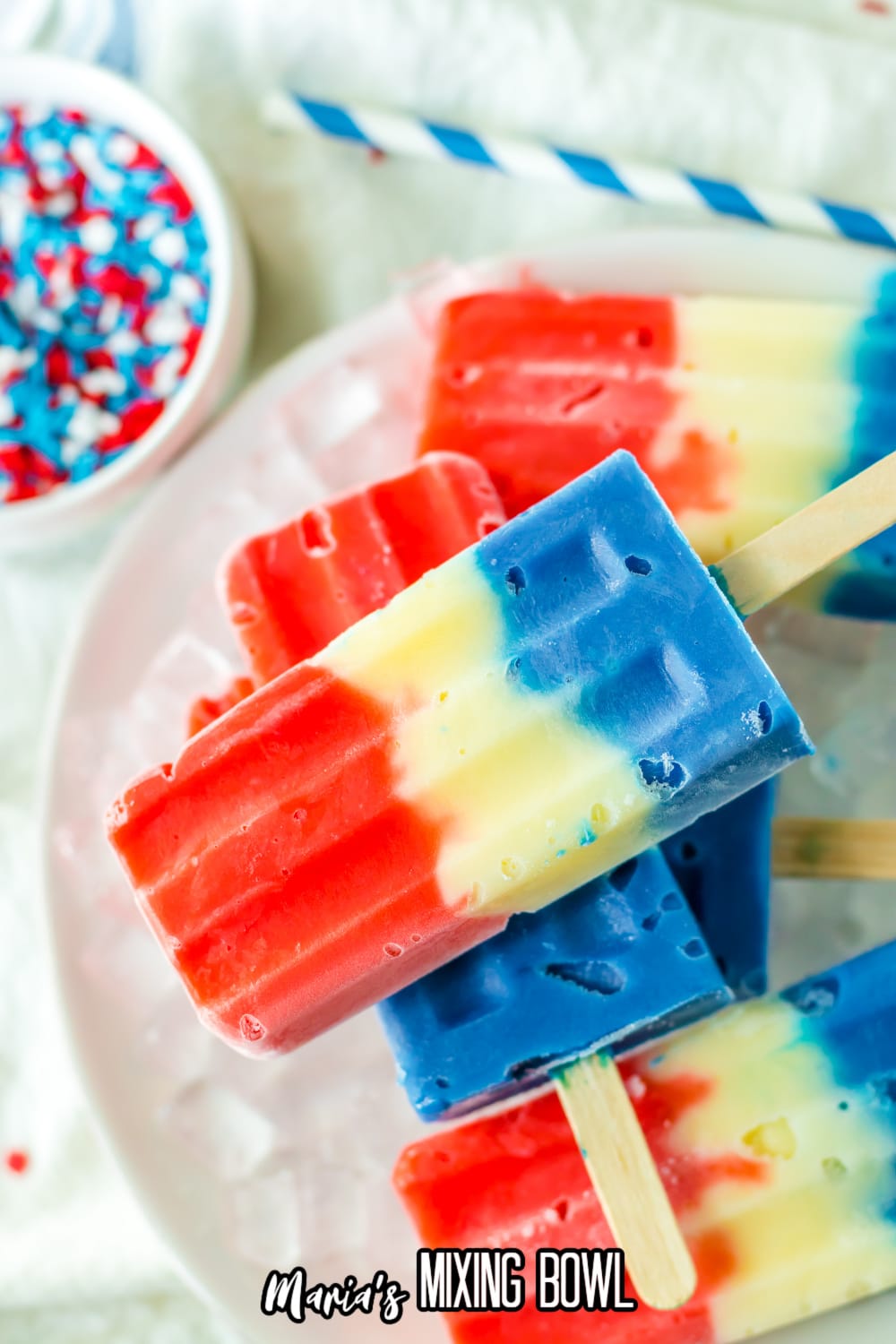 red white and blue pudding pops stacked on a bed of ice