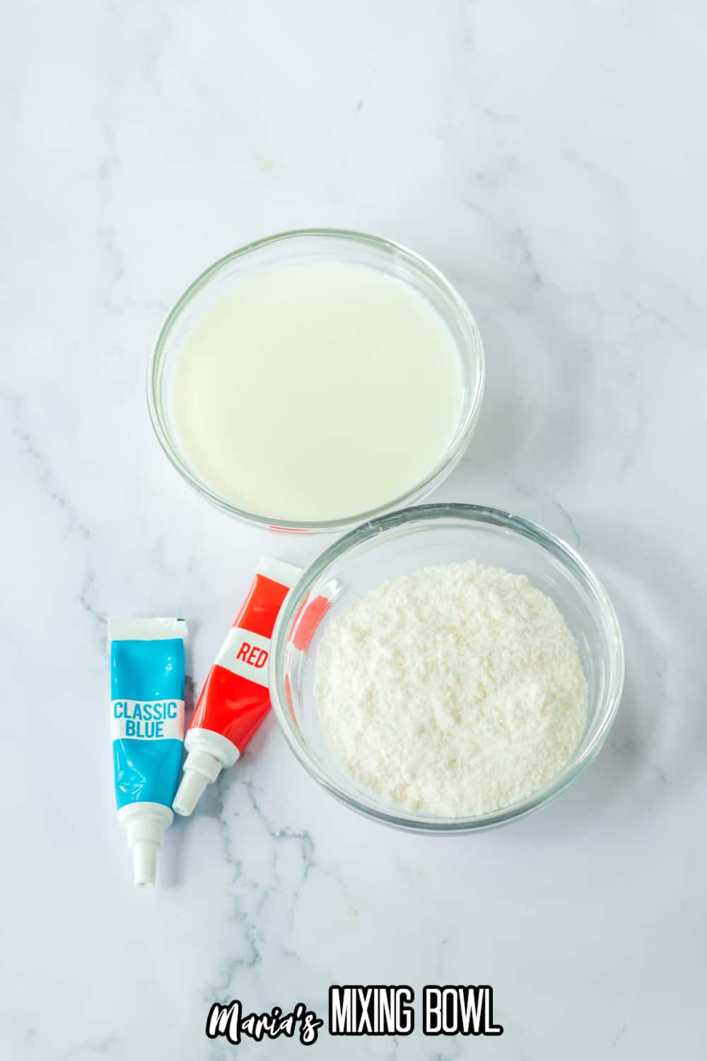 small bowls of milk, instant pudding mix, blue and red food coloring tubes