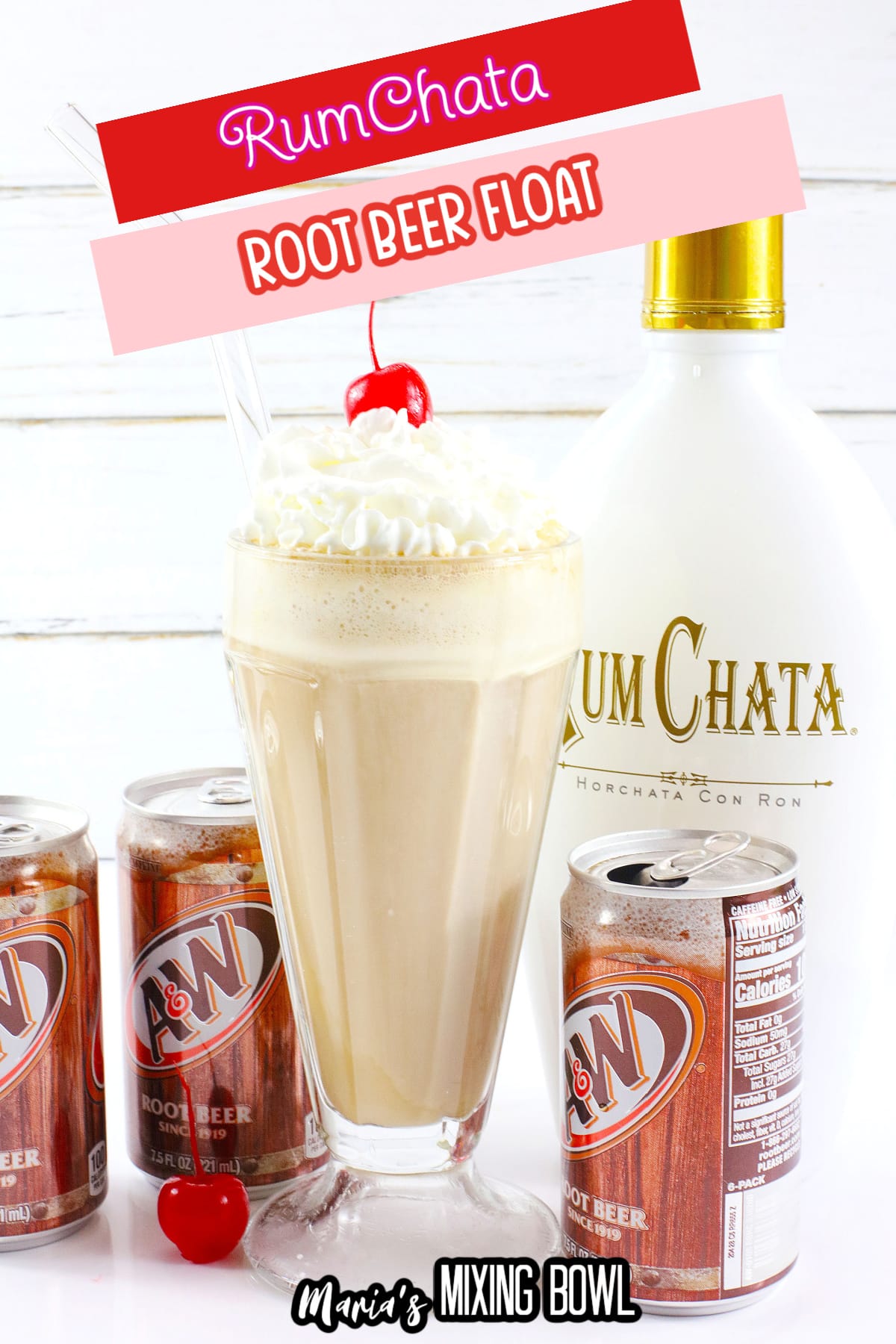 milkshake glass filled with a root beer float topped with whipped cream and a cherry