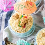 sand bucket dessert in a plastic bucket on a blue and white kitchen towel