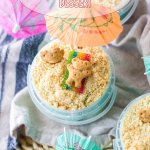 sand bucket dessert in a plastic bucket on a blue and white kitchen towel