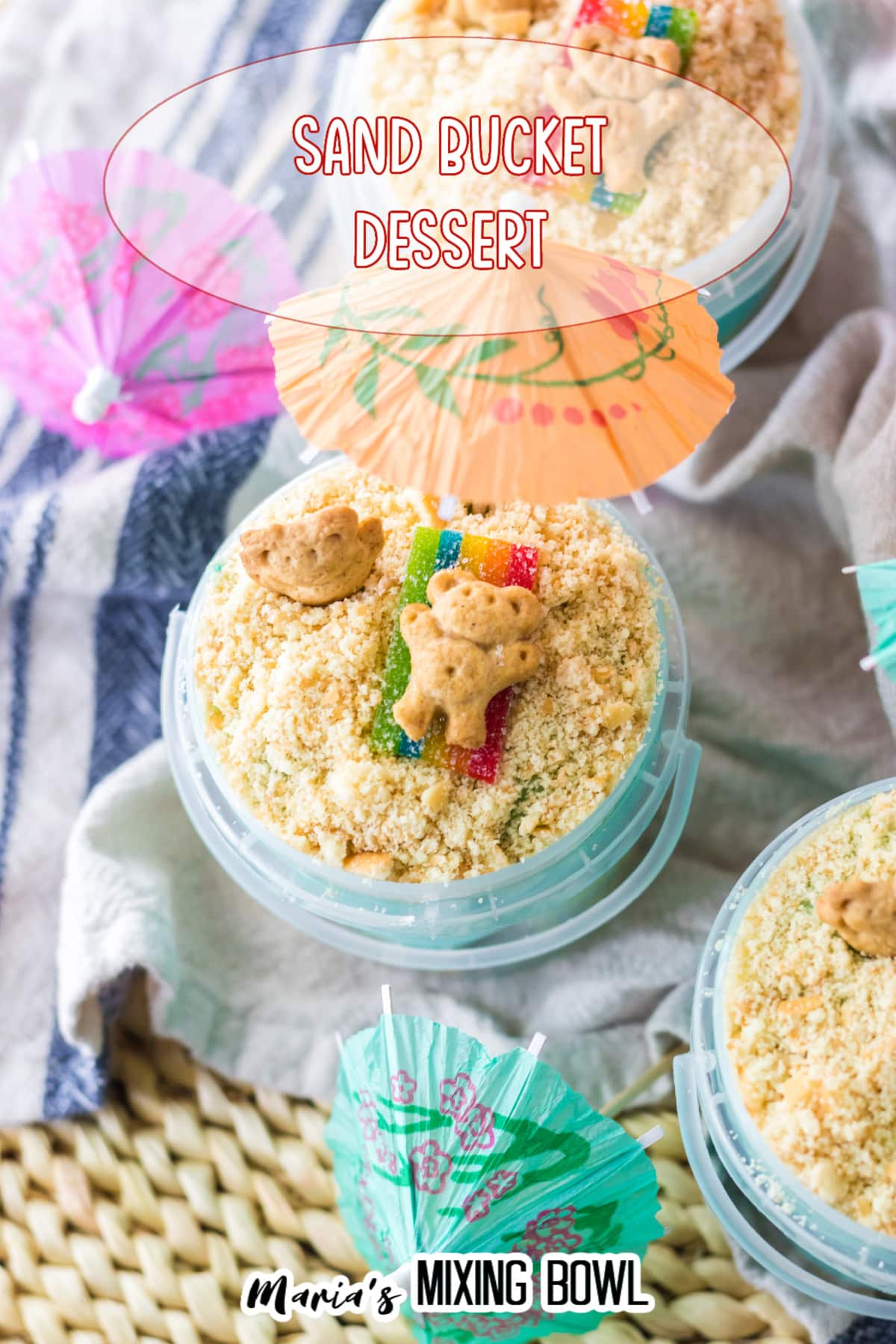 sand bucket dessert in a plastic bucket on a blue and white kitchen towel