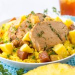 slow cooker pineapple pork on a bed of yellow rice