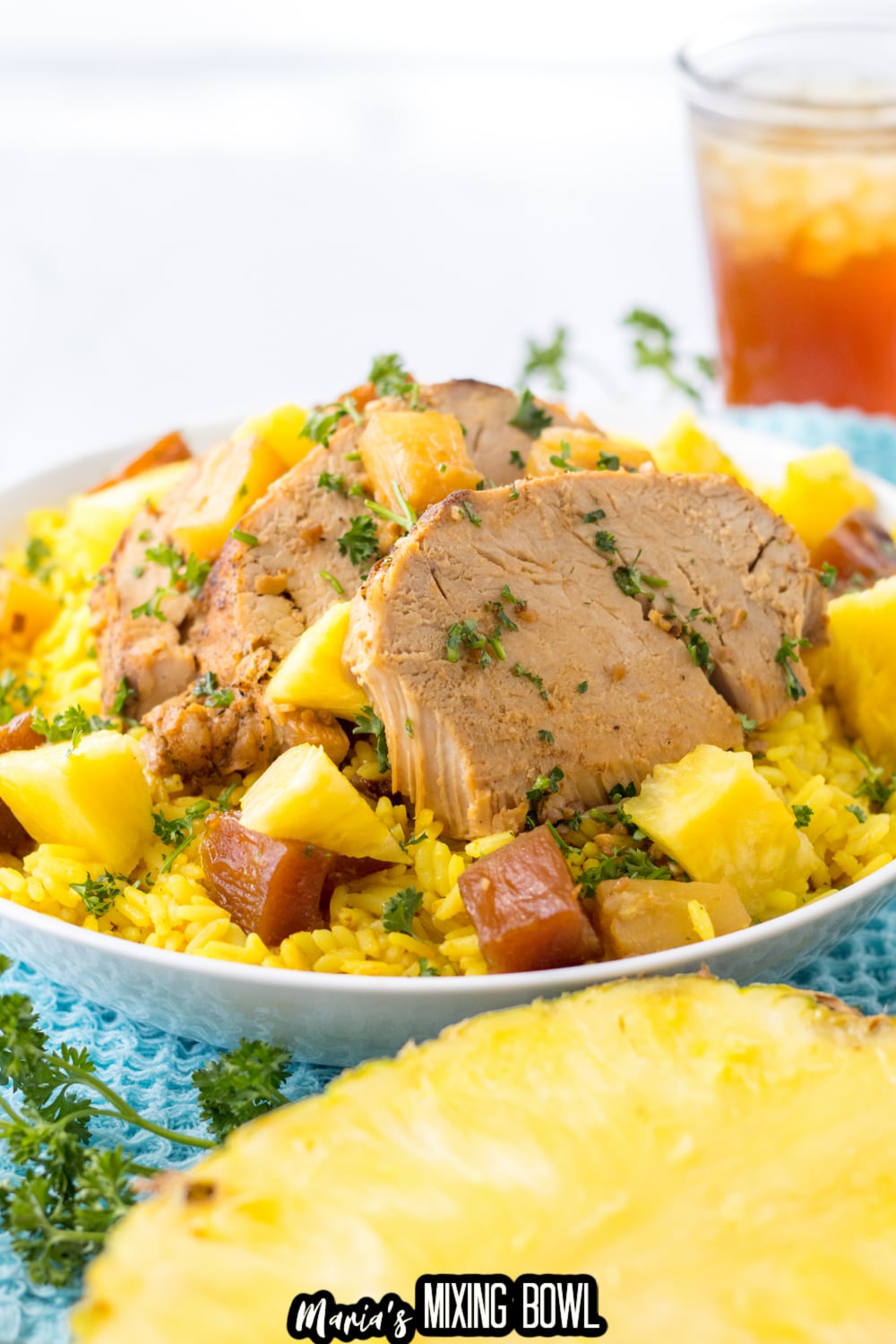 slow cooker pineapple pork on a bed of yellow rice