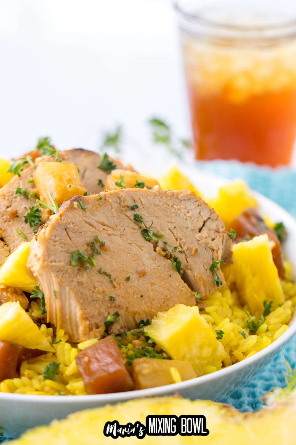 slow cooker pineapple pork on a bed of yellow rice