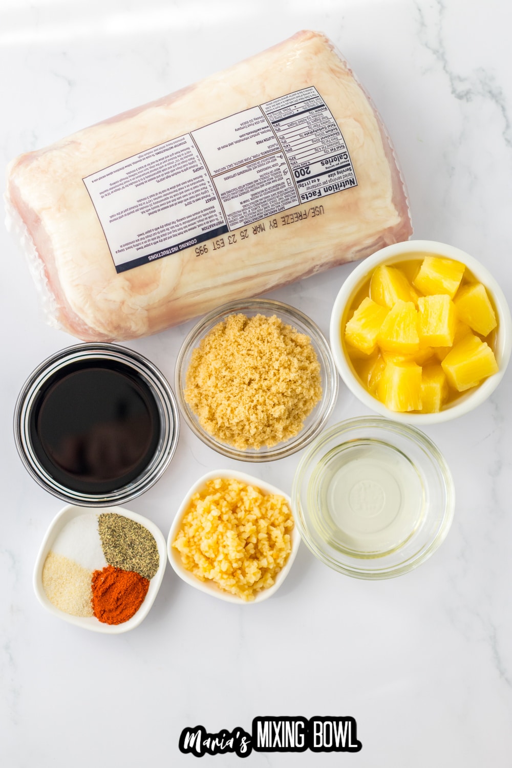 pork tenderloin, soy sauce, brown sugar, pineapple, seasonings, garlic, on a white marble background