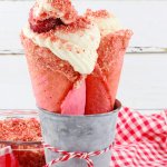 two strawberry cheesecake cones in a metal bowl