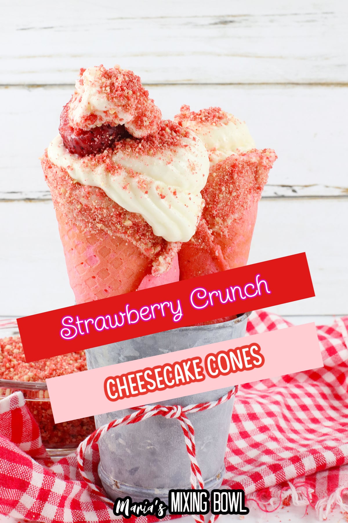 two strawberry cheesecake cones in a metal bowl