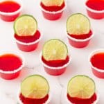 margarita shots rimmed with salt and a lime wedge