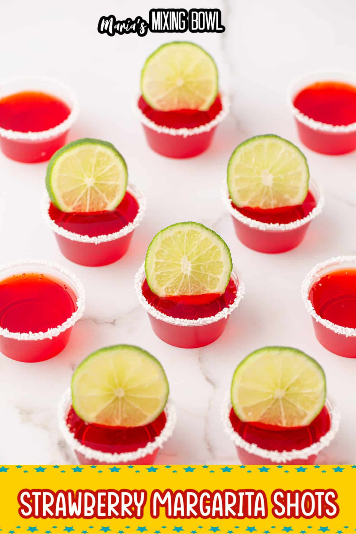 margarita shots rimmed with salt and a lime wedge