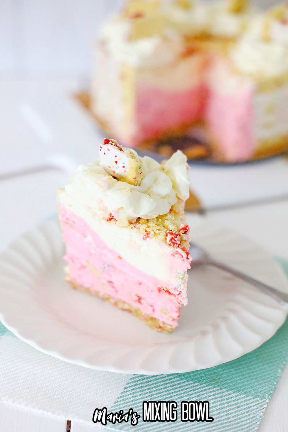 slice of strawberry poptart cheesecake on a white plate