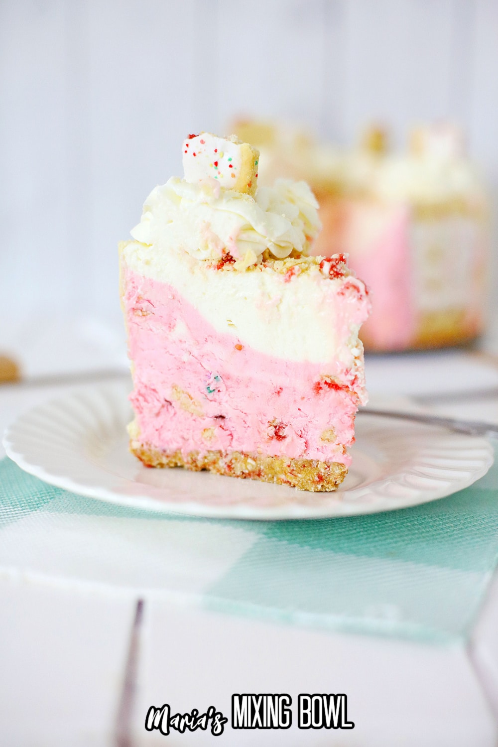 slice of strawberry poptart cheesecake on a white plate