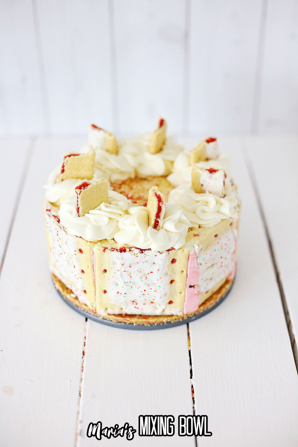 finished strawberry poptart cheesecake on a wooden background