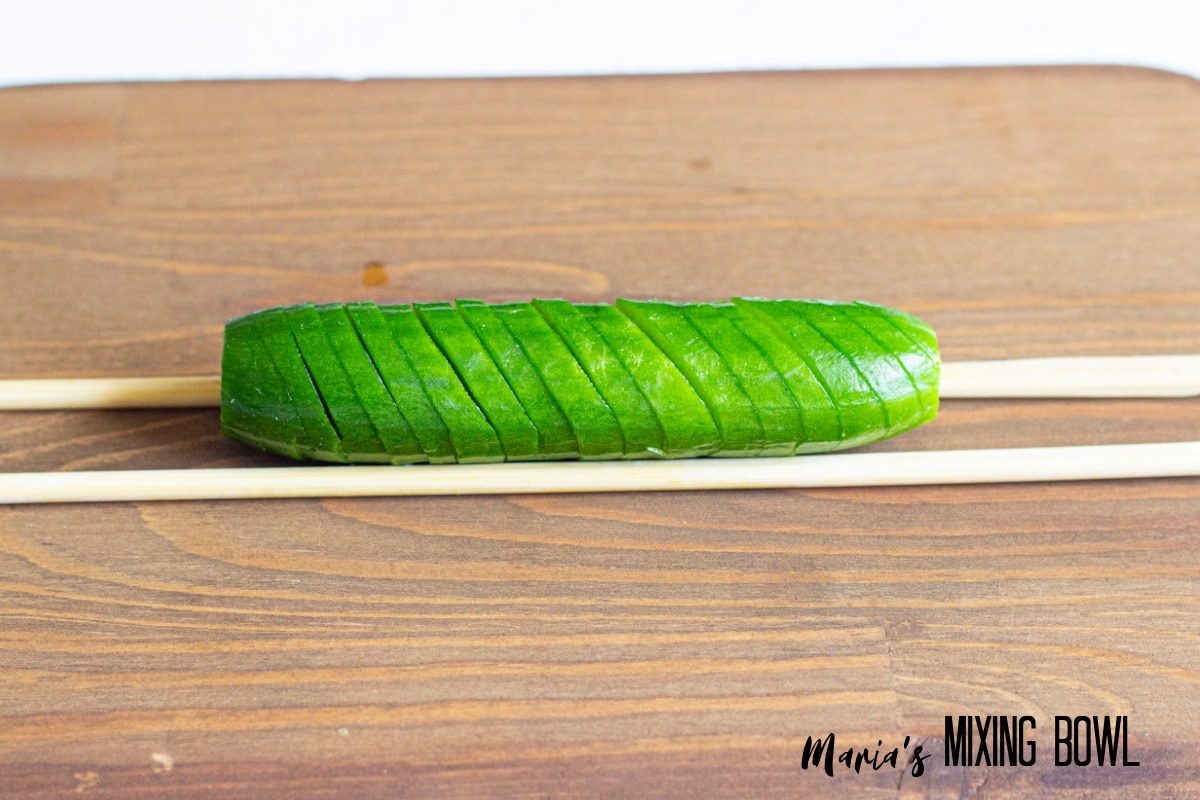sliced cucumber on a cutting board