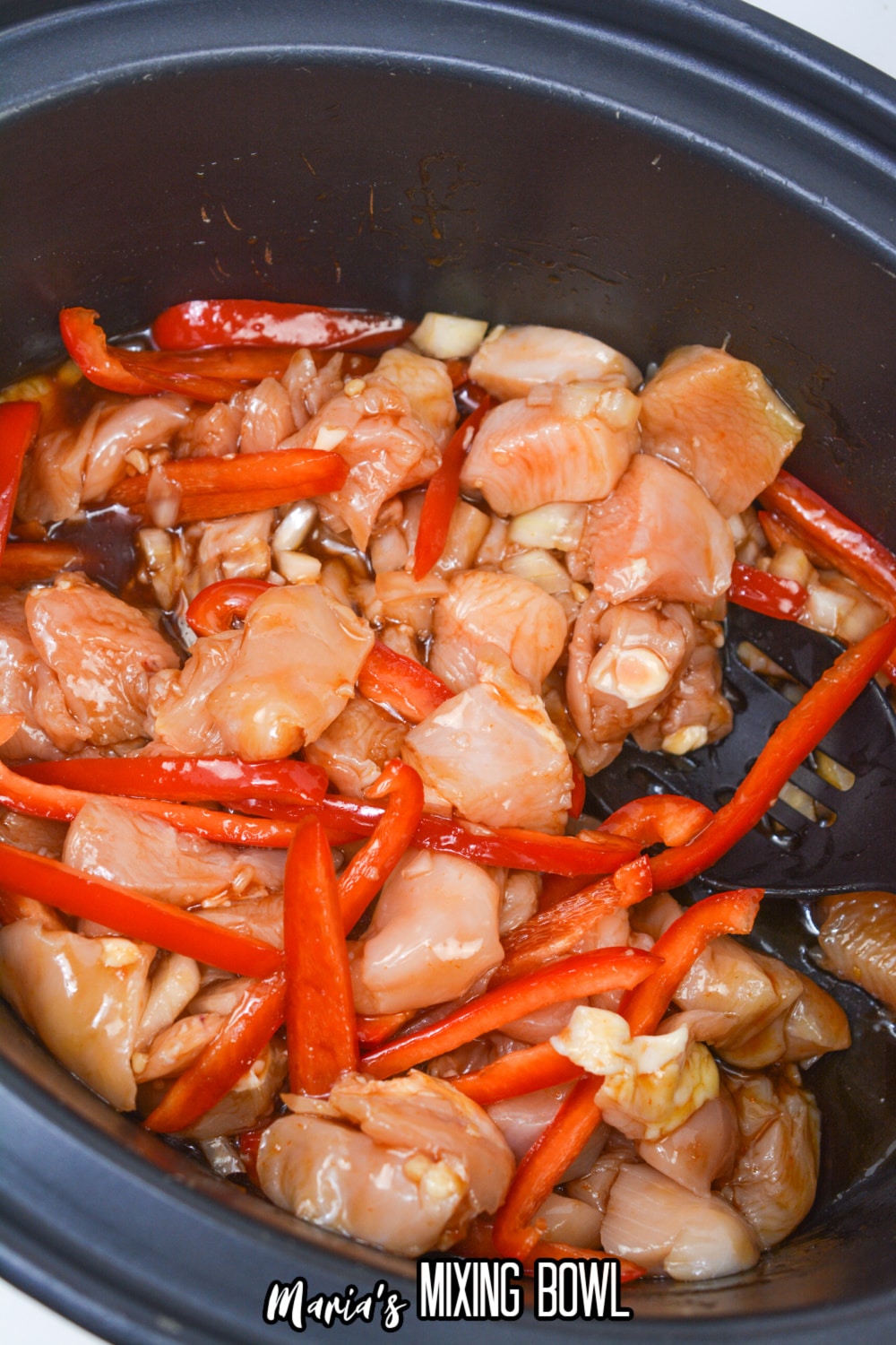 chicken, peppers and honey garlic sauce in a slow cooker