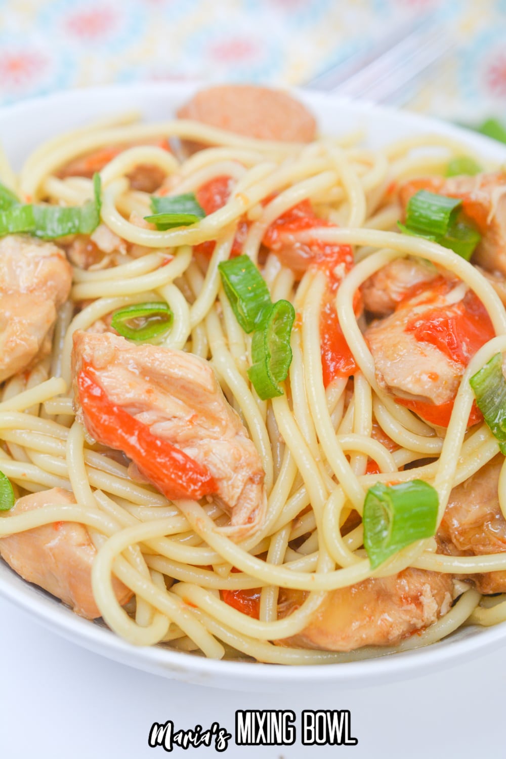 white bowl filled with honey garlic chicken and noodles