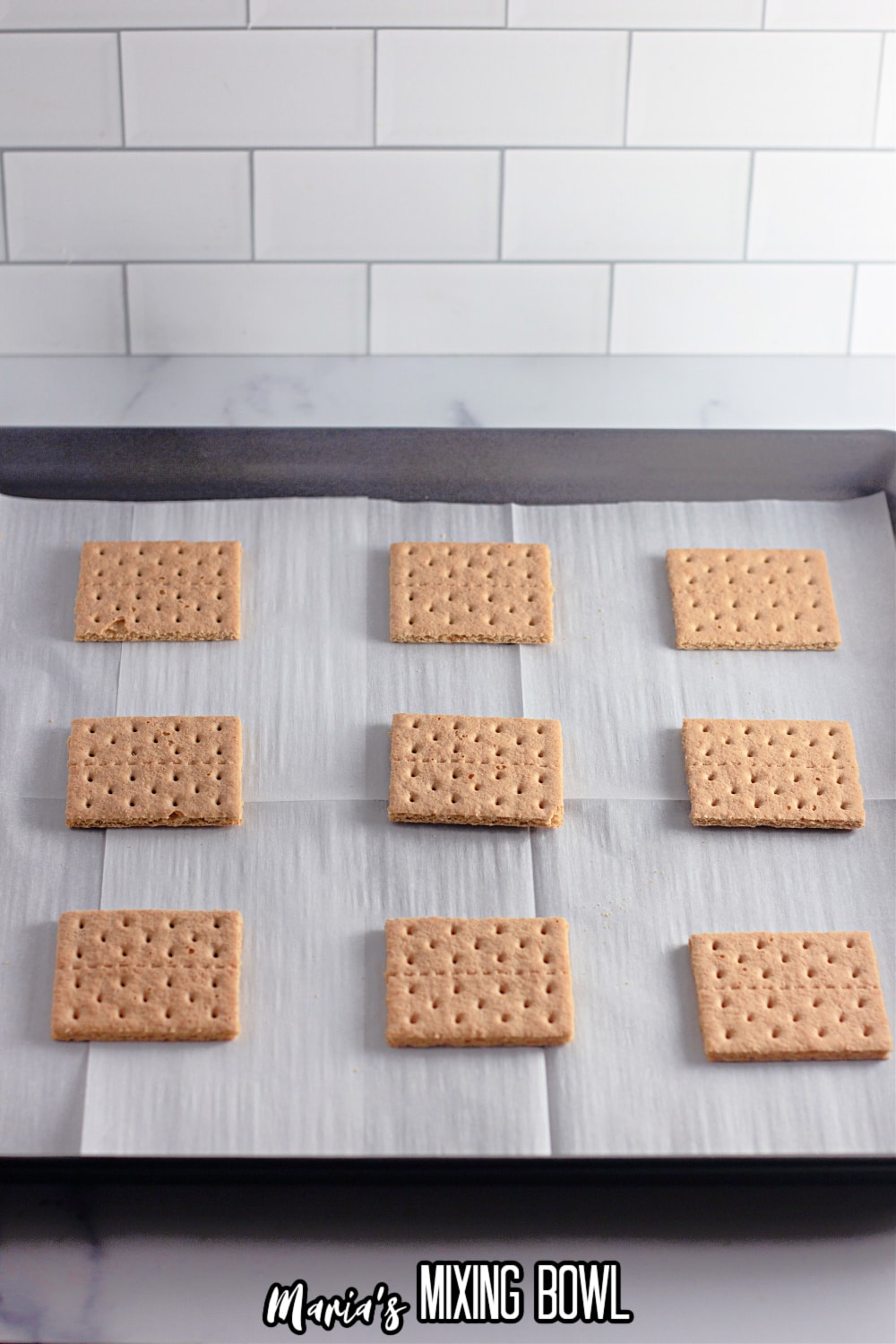 graham crackers on a parchment lined baking sheet