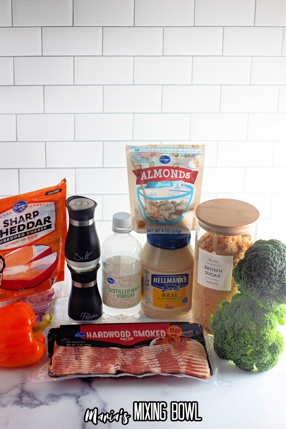 shredded cheese, bell pepper, onions, bacon, salt and pepper, vinegar, almonds, mayo, brown sugar and broccoli