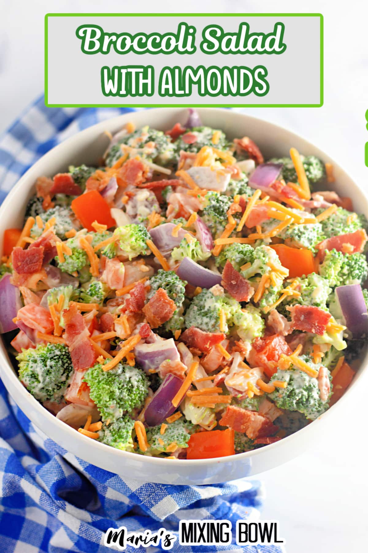 close up of a broccoli salad with almonds on a white background