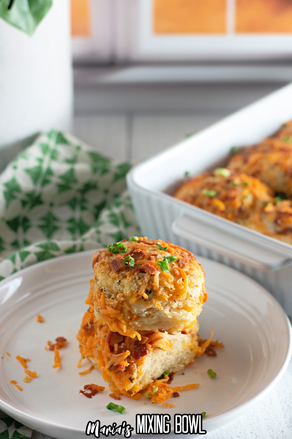 two cheddar bacon ranch biscuits stacked on top of each other